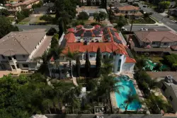 Questions about surrogacy are raised in case of California couple with house brimming with kids